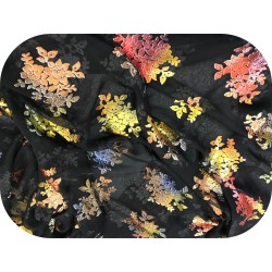 Mousseline dévoré noir en velours aux motifs chatoyants "Élégance multicolore.